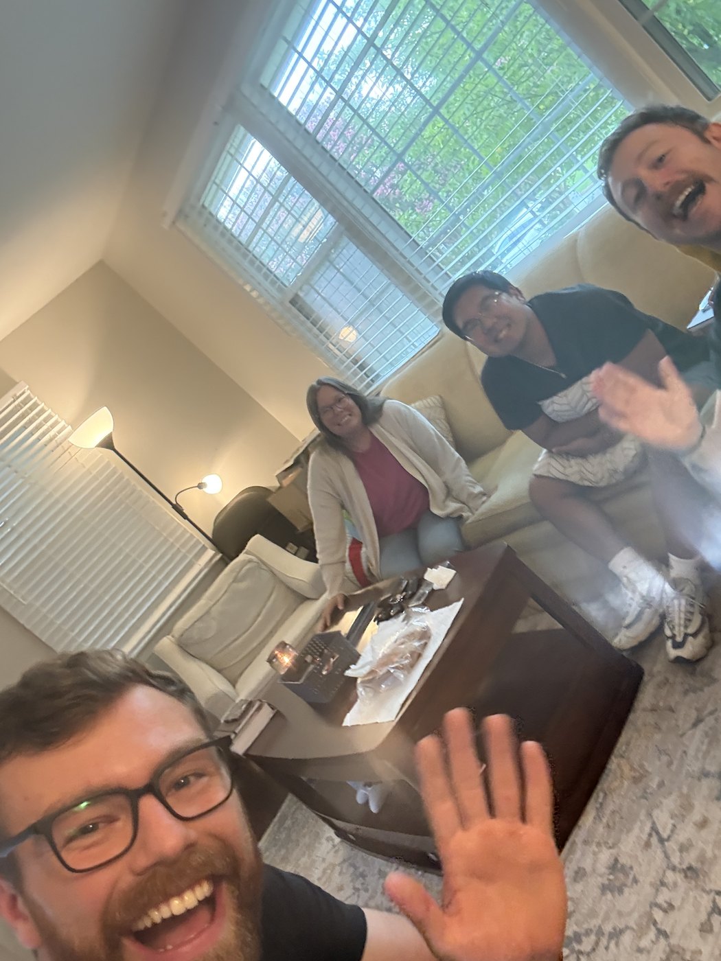 Community group selfie in a living room