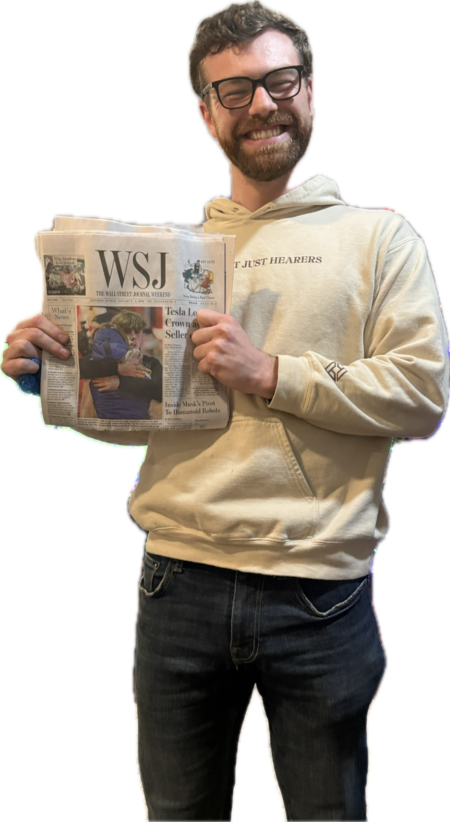 Jack O'Connor holding a copy of the Wall Street Journal